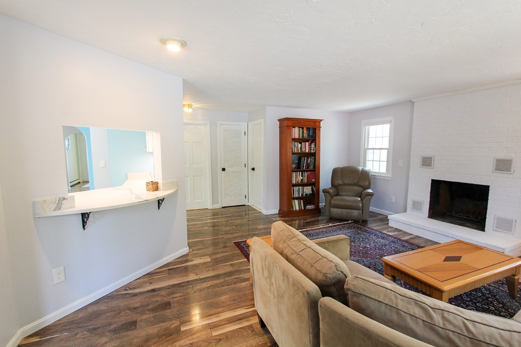 47 Foxglove Road Barnstable, MA 02632 - Photo 4 of 33 a living room with furniture and a fireplace