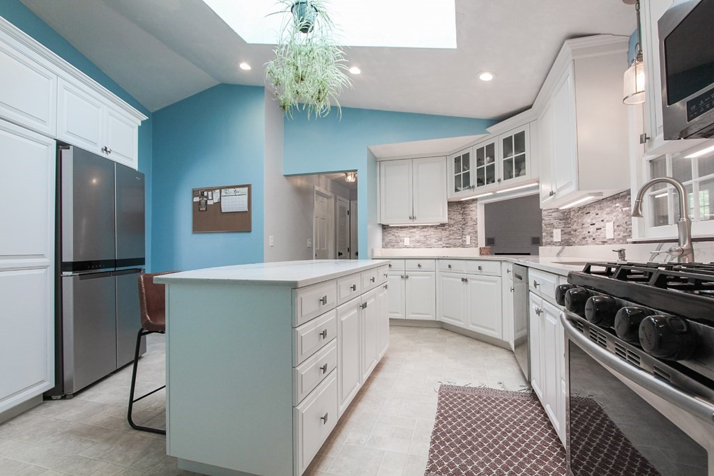 47 Foxglove Road Barnstable, MA 02632 - Photo 8 of 33 a kitchen with stainless steel appliances a refrigerator sink and stove