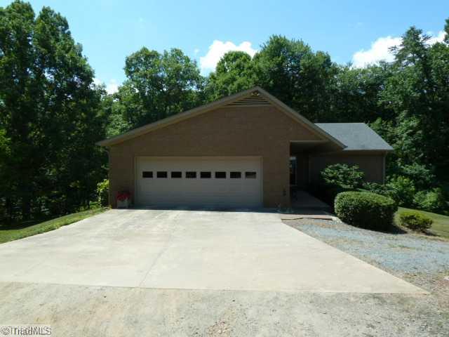 1195 Daisy Trail Road Germanton, NC 27019 - Photo 2 of 16 Exterior Front. Home is nestled on 12.12 Acres, additional parcel has 7.29 acres and would be a great building site....low taxes! Oversized 2 car garage.