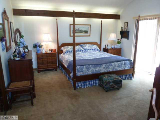 1195 Daisy Trail Road Germanton, NC 27019 - Photo 11 of 16 Master Bedroom. Upper level master bedroom with mirrored wardrobe, sliding doors to patio and private bath