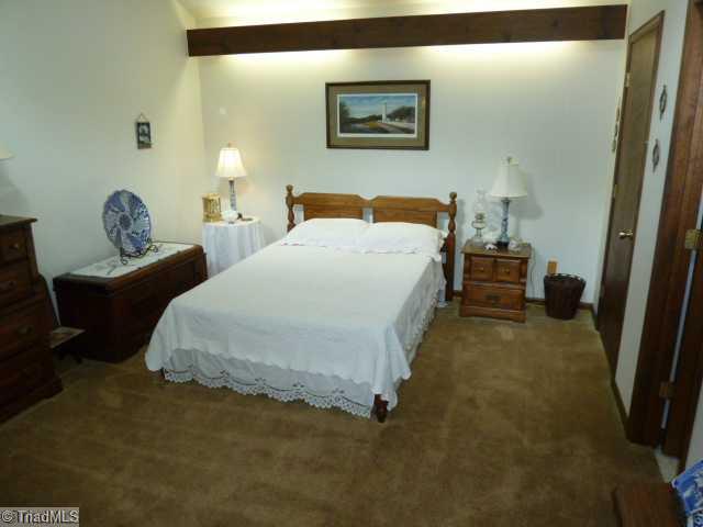 1195 Daisy Trail Road Germanton, NC 27019 - Photo 10 of 16 2nd Bedroom. Upper level bedroom has a vaulted ceiling, walk in closet and private bath