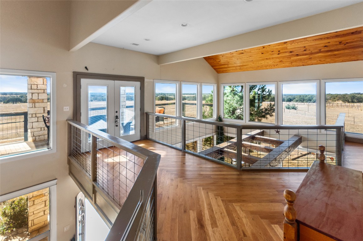 6588 Starks Road Mason, TX 76856 - Photo 21 of 40 a view of a living room and kitchen with furniture and large windows