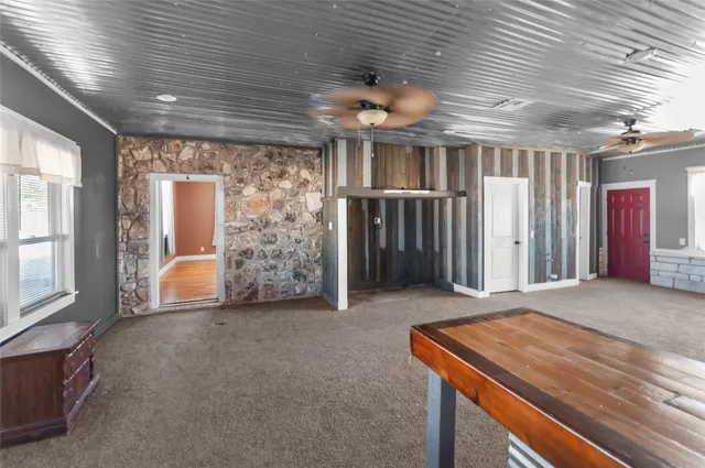 a view of an empty room and window