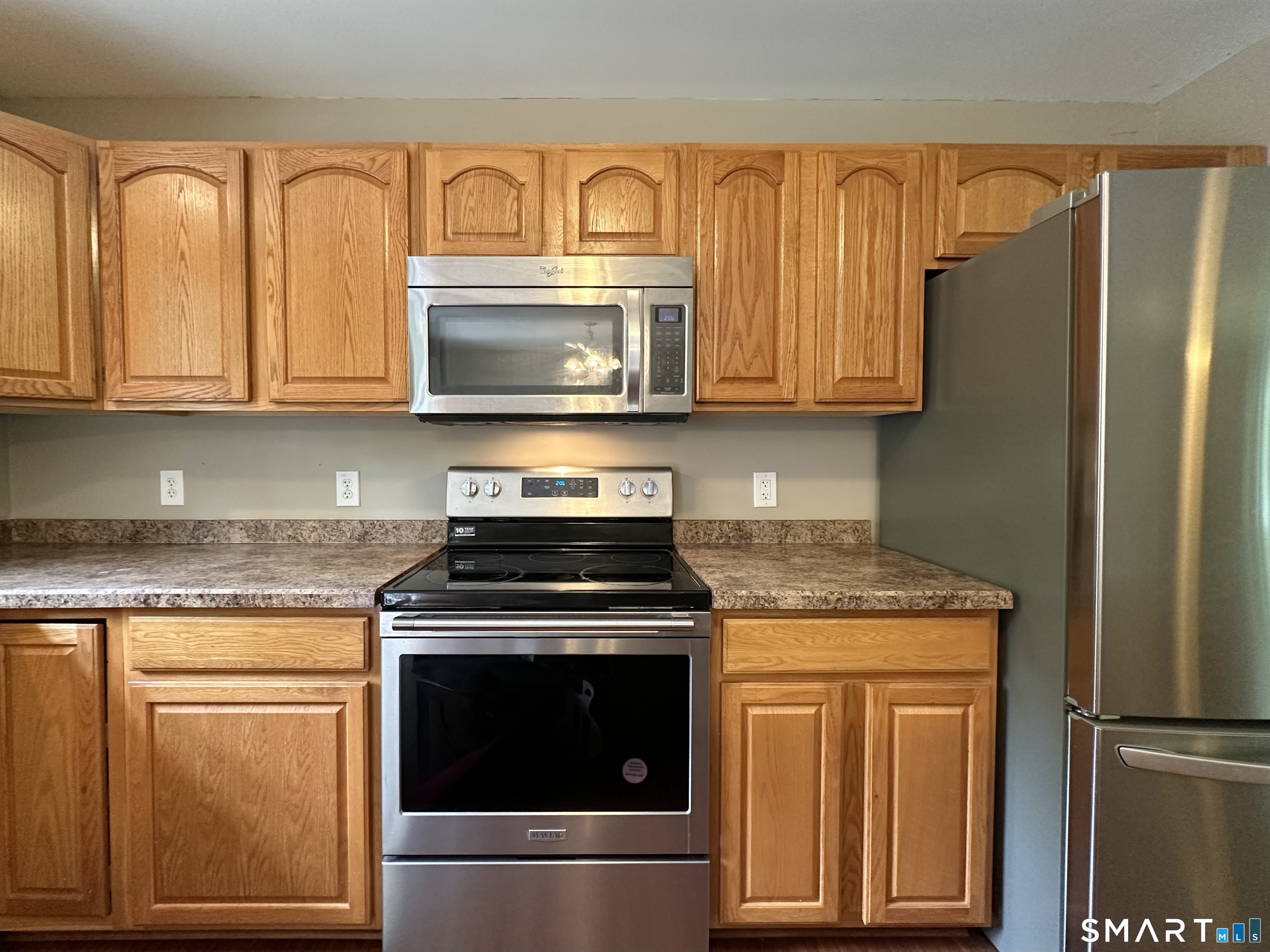 116 Tatnic Hill Road Brooklyn, CT 06234 - Photo 19 of 27 a kitchen with granite countertop cabinets stainless steel appliances and a sink