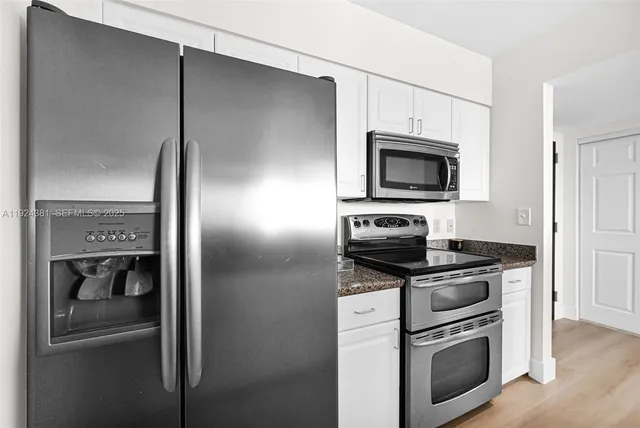 a close view of a utility room with washer and dryer
