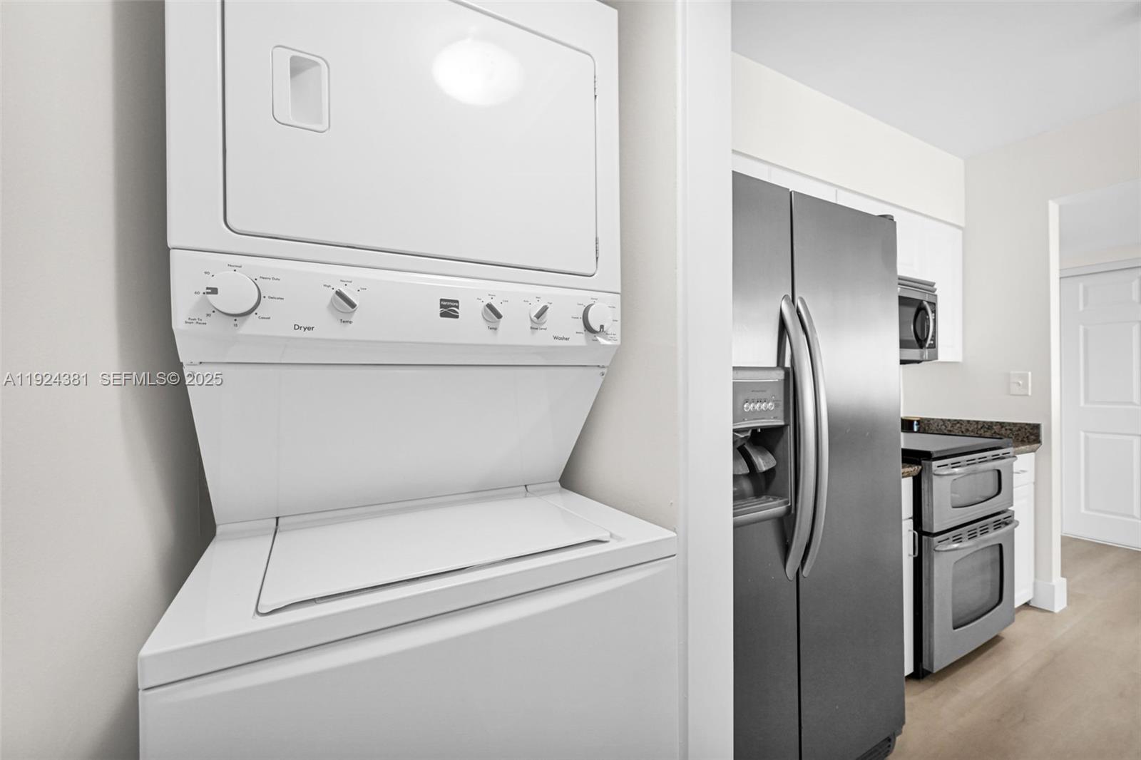 90 Alton Road, Unit 1908 Miami Beach, FL 33139 - Photo 16 of 57 a close view of a utility room with washer and dryer