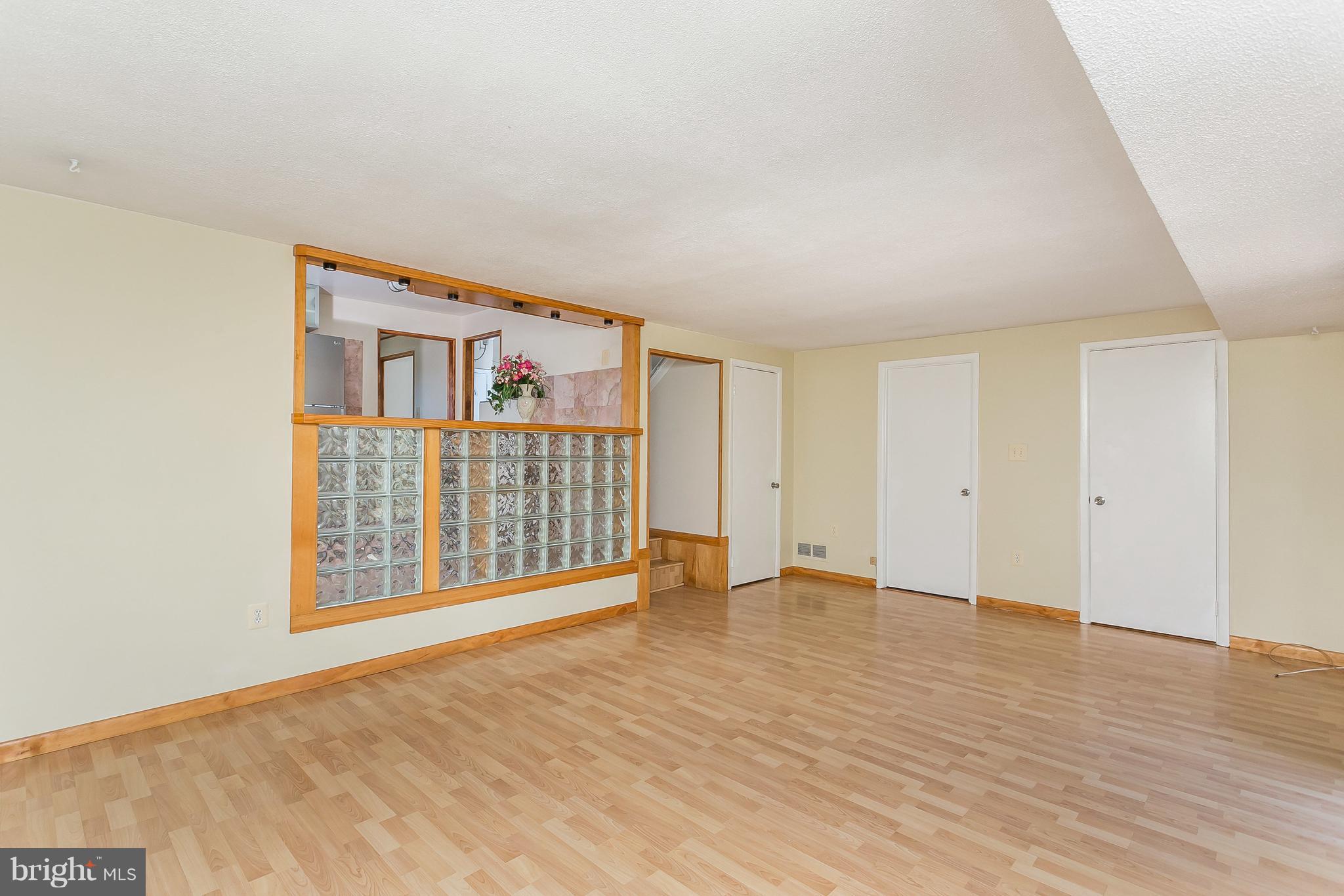4812 Galley Road Baltimore, MD 21236 - Photo 14 of 30 a view of an empty room with wooden floor