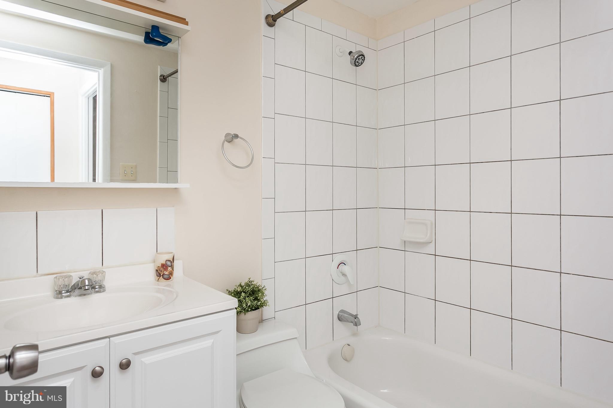 4812 Galley Road Baltimore, MD 21236 - Photo 25 of 30 a bathroom with a sink and a shower