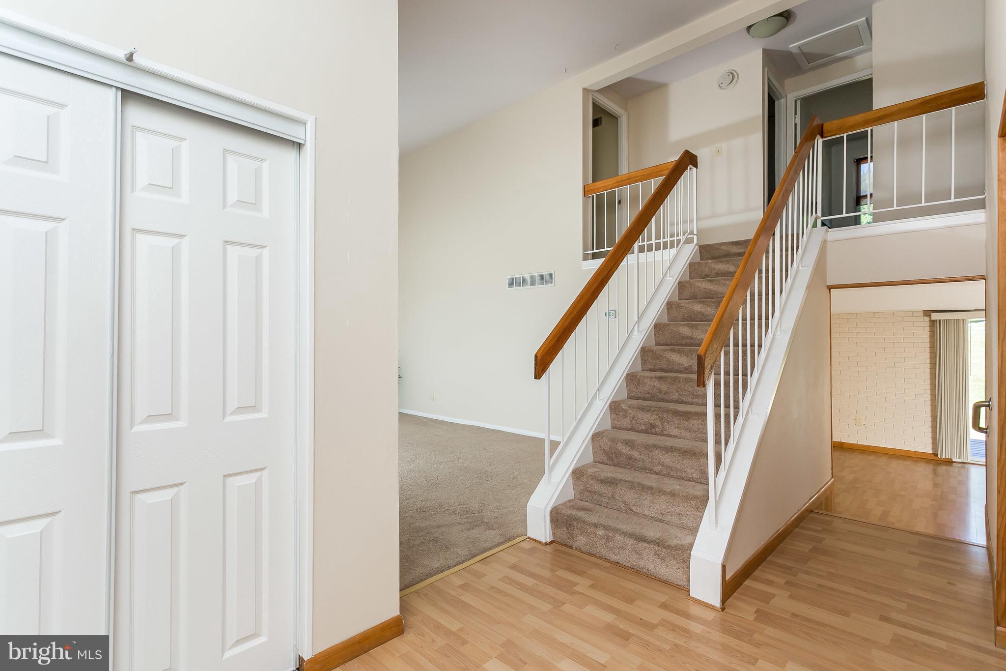 4812 Galley Road Baltimore, MD 21236 - Photo 4 of 30 a view of a hallway with wooden floor and staircase
