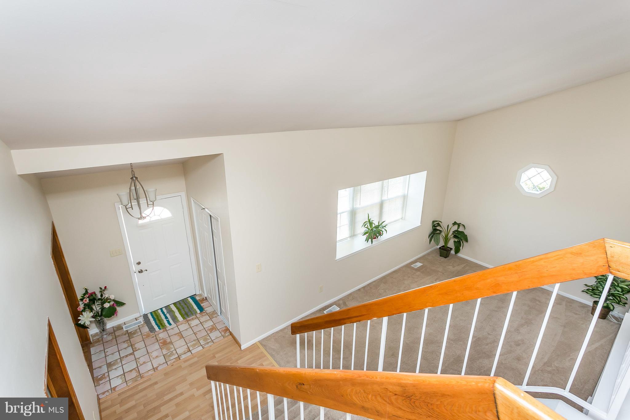 4812 Galley Road Baltimore, MD 21236 - Photo 7 of 30 a view of a porch with wooden floor and windows