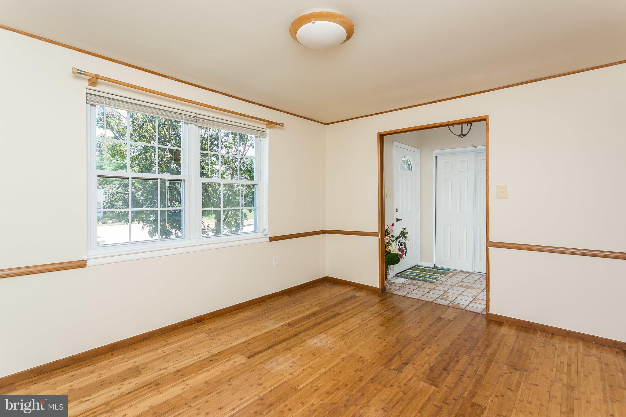 4812 Galley Road Baltimore, MD 21236 - Photo 8 of 30 a view of empty room with wooden floor and fan