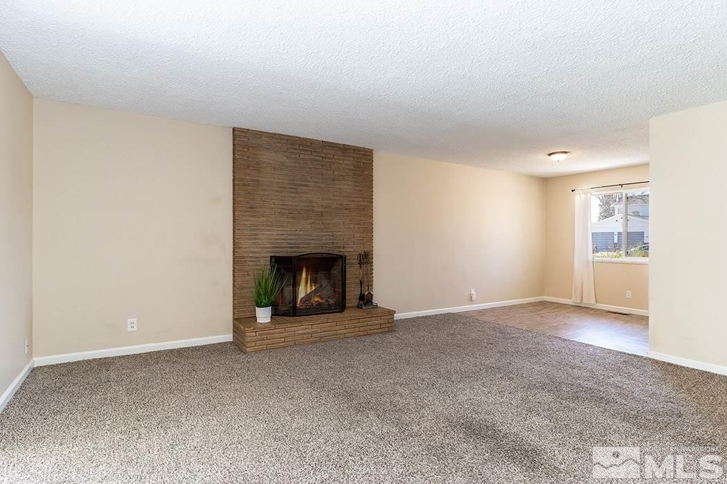 1395 Roberts Street Reno, NV 89502 - Photo 8 of 27 a view of an empty room with a fireplace