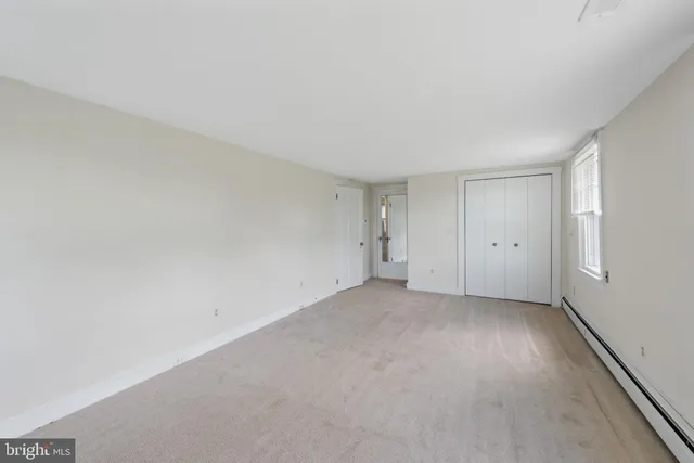 a view of an empty room and window