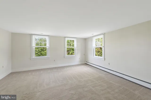 an empty room with windows