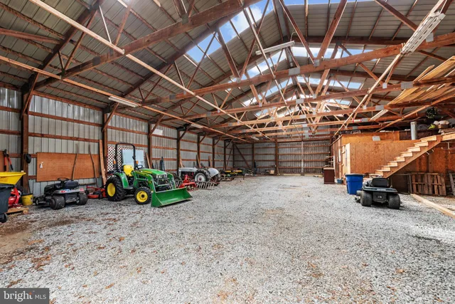 a backyard of a house with plants and a yard