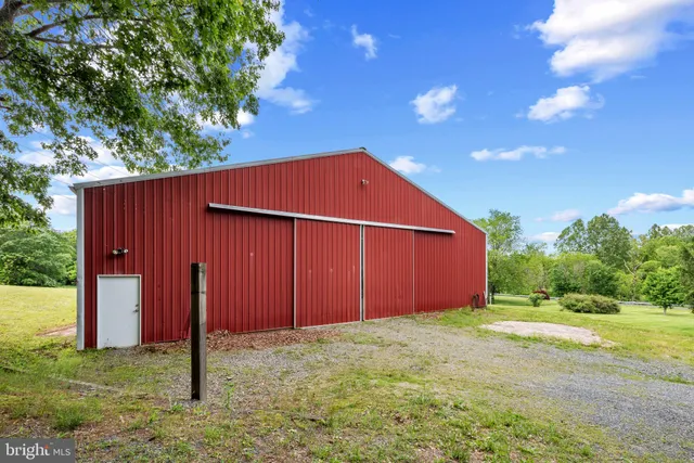 a view of a yard with potted plants