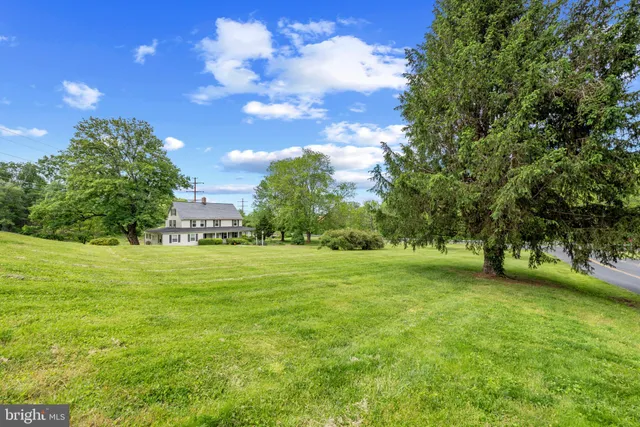 a view of field with trees in the background