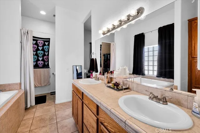 a bathroom with a tub and a sink