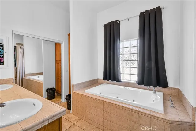 a bedroom with a bed and a desk