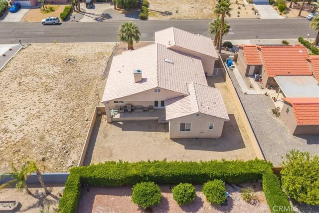 an aerial view of a house with a yard