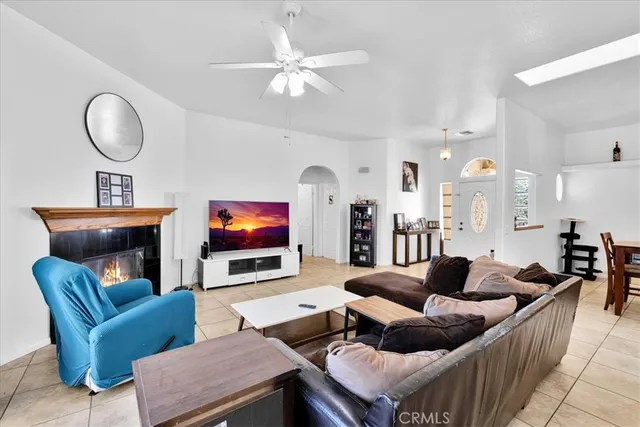 a view of a dining room with furniture and a chandelier