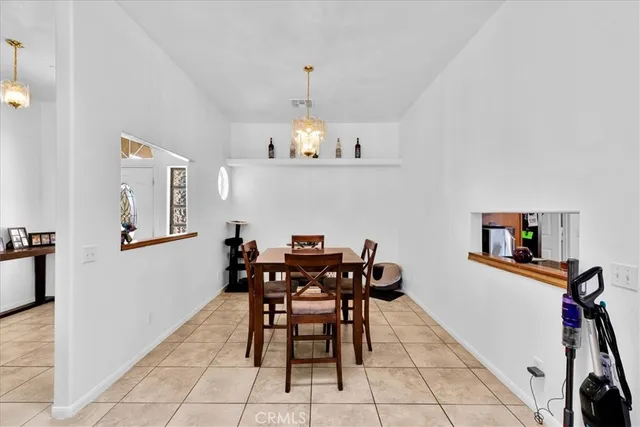 a kitchen with granite countertop cabinets and window