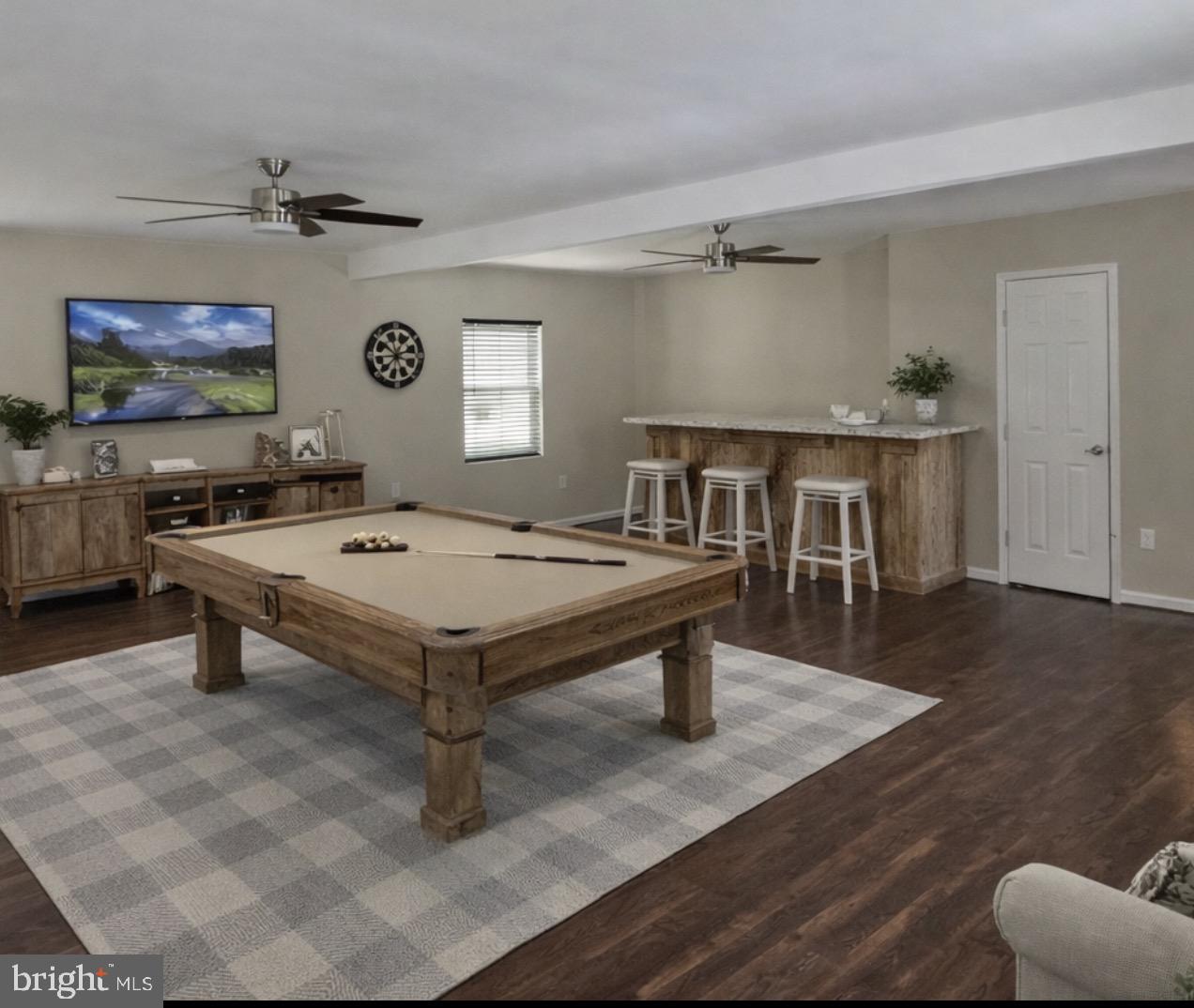 92 McCarty Road Fredericksburg, VA 22405 - Photo 11 of 39 a living room with a table and a wooden floor