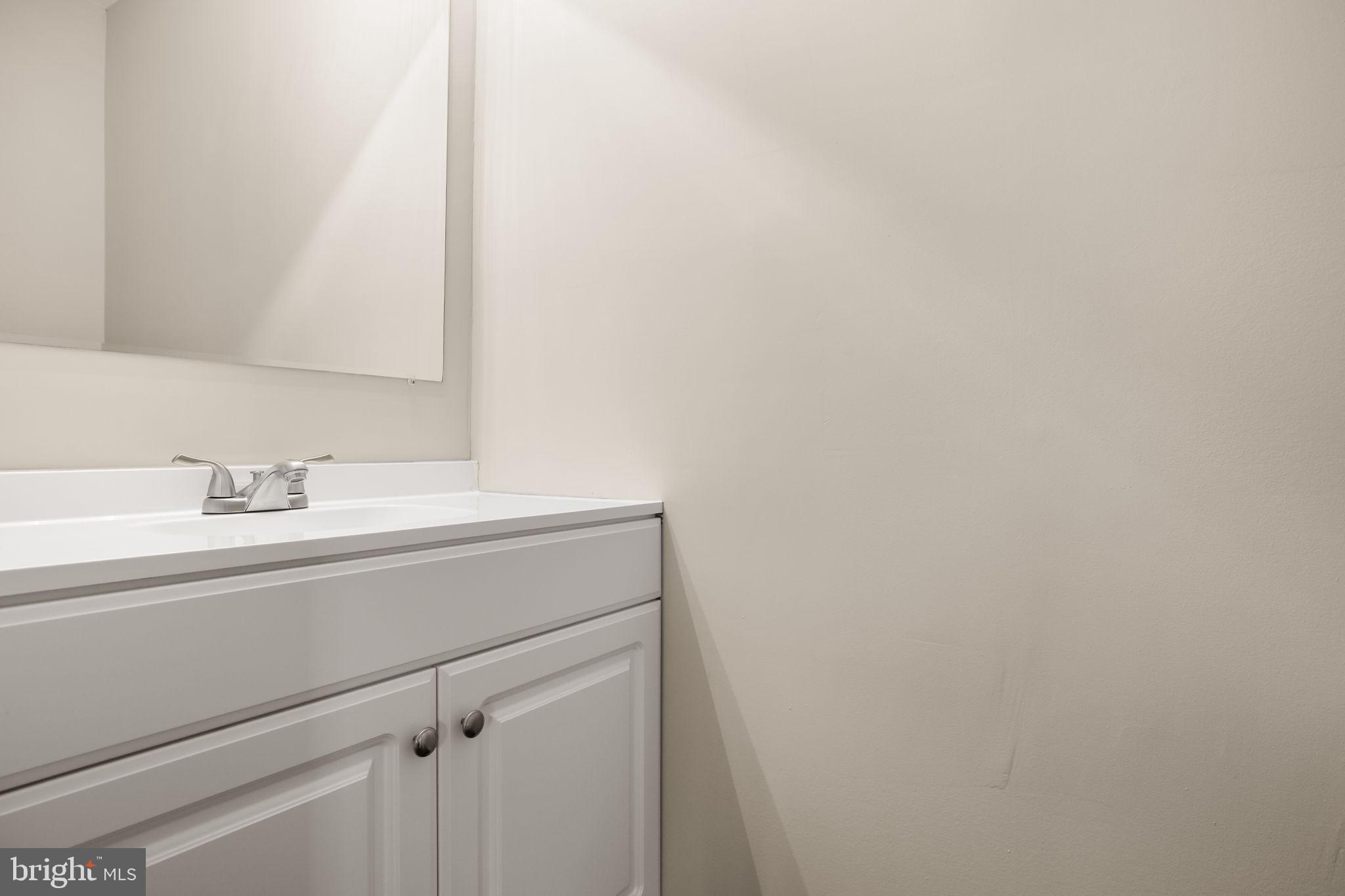 92 McCarty Road Fredericksburg, VA 22405 - Photo 14 of 31 a bathroom with a sink and a mirror