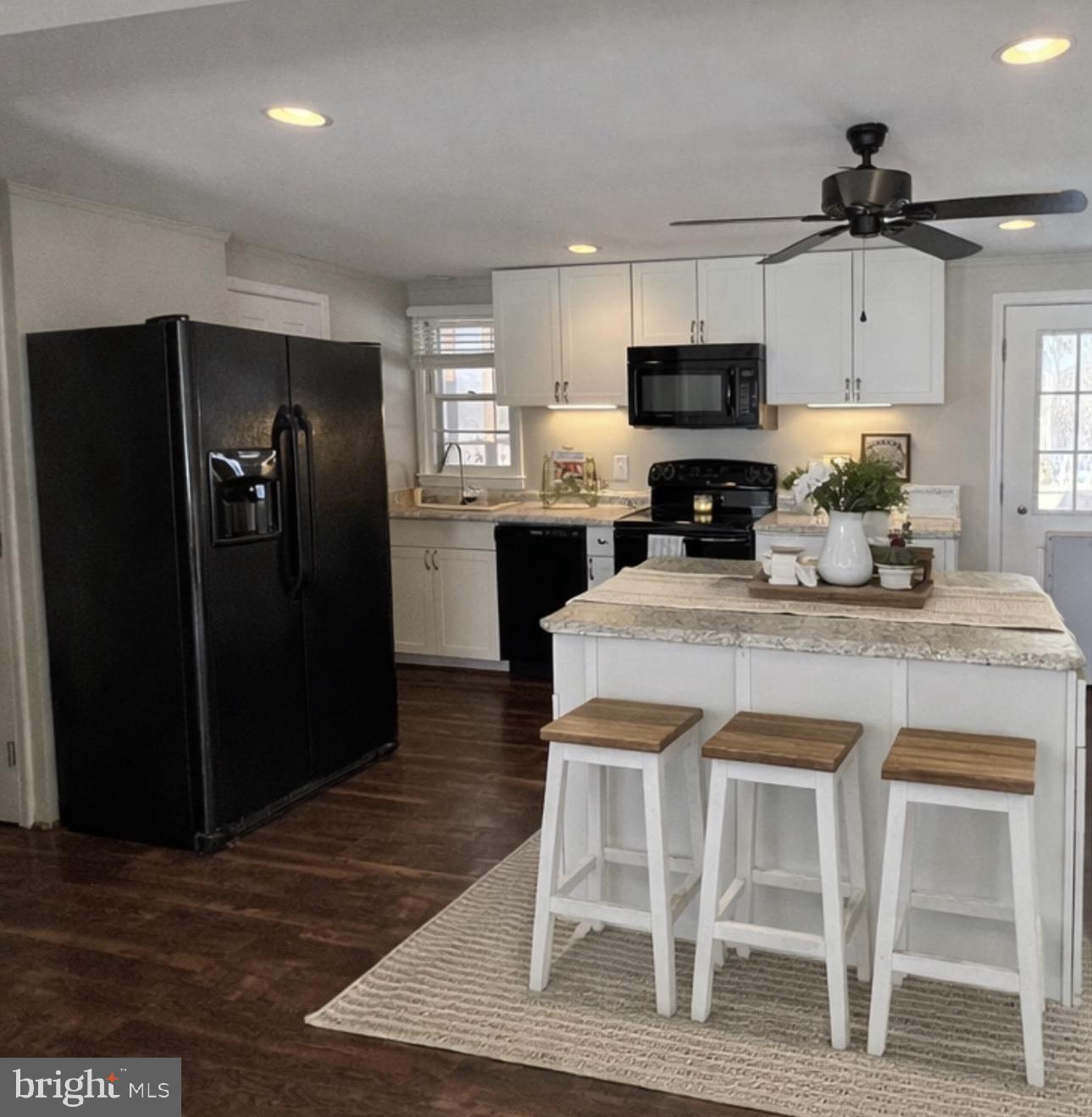 92 McCarty Road Fredericksburg, VA 22405 - Photo 4 of 39 a kitchen with stainless steel appliances granite countertop a refrigerator and a stove top oven