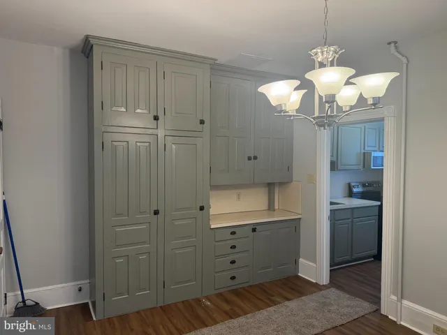 a view of a hallway with chandelier