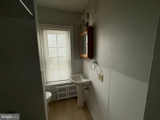 a bathroom with a sink toilet and tub