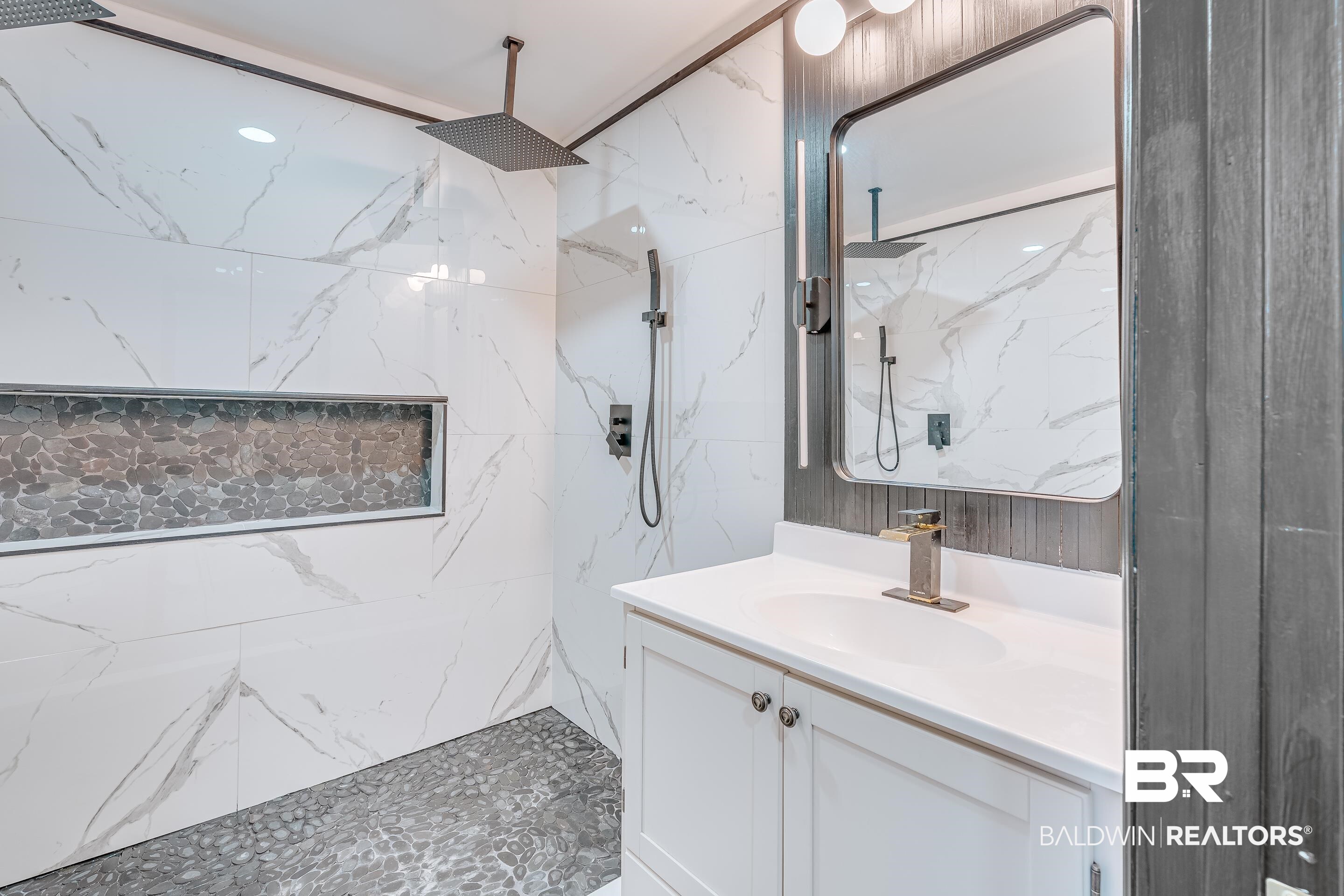 1190 Military Road Mount Vernon, AL 36560 - Photo 27 of 47 Bathroom with vanity and a marble finish shower