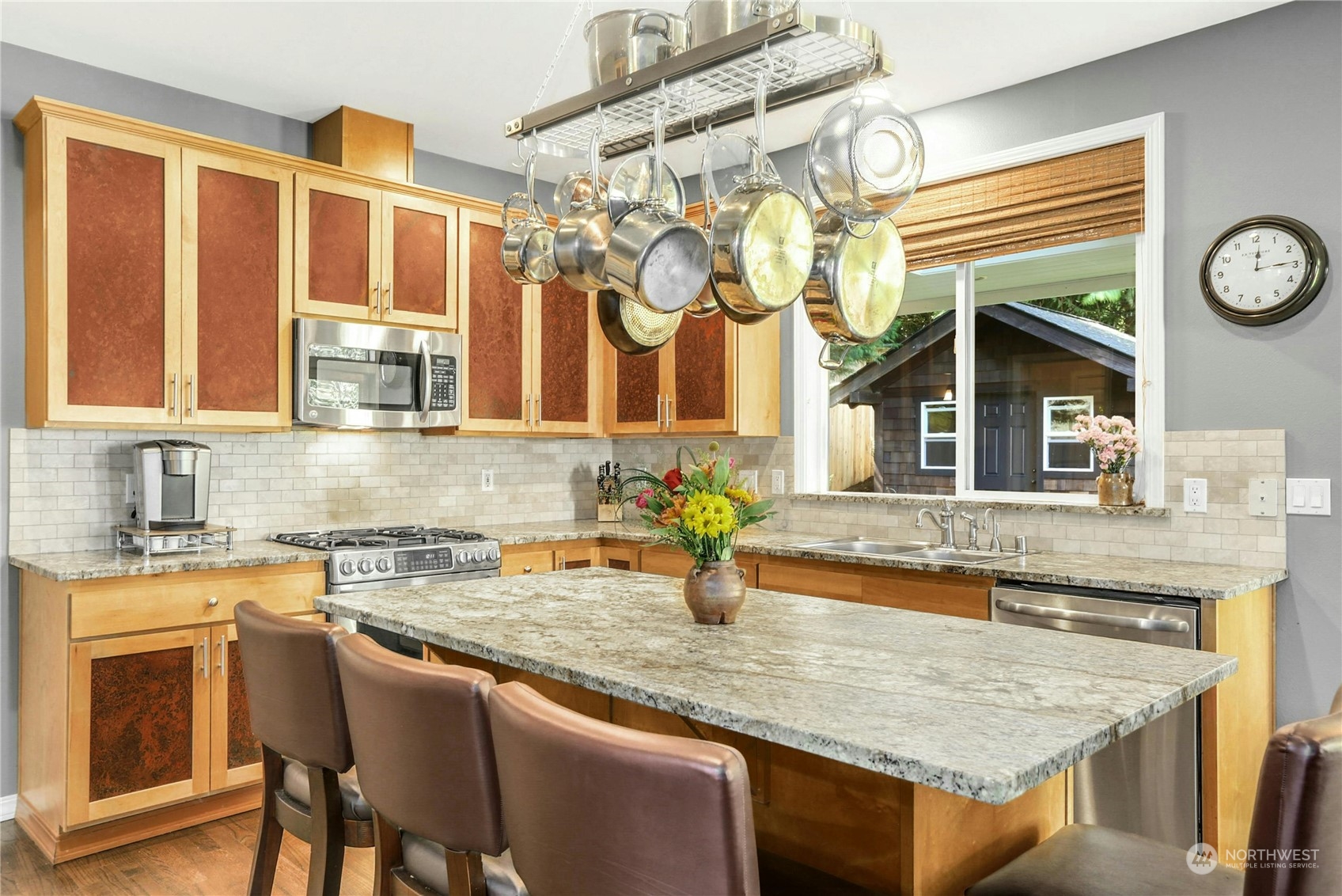 17309 106th Place Northeast Bothell, WA 98011 - Photo 12 of 39 a kitchen with a sink a stove and cabinets