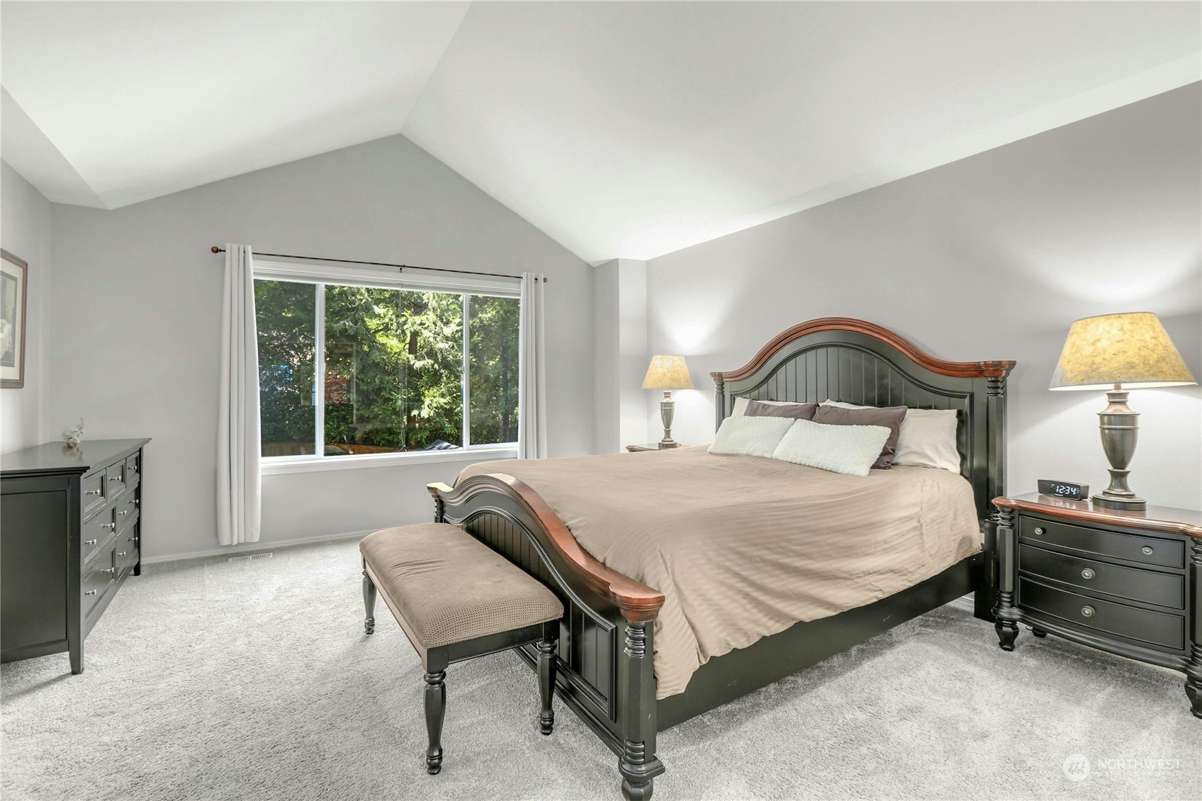 17309 106th Place Northeast Bothell, WA 98011 - Photo 19 of 39 a bedroom with a bed and a dresser next to a window