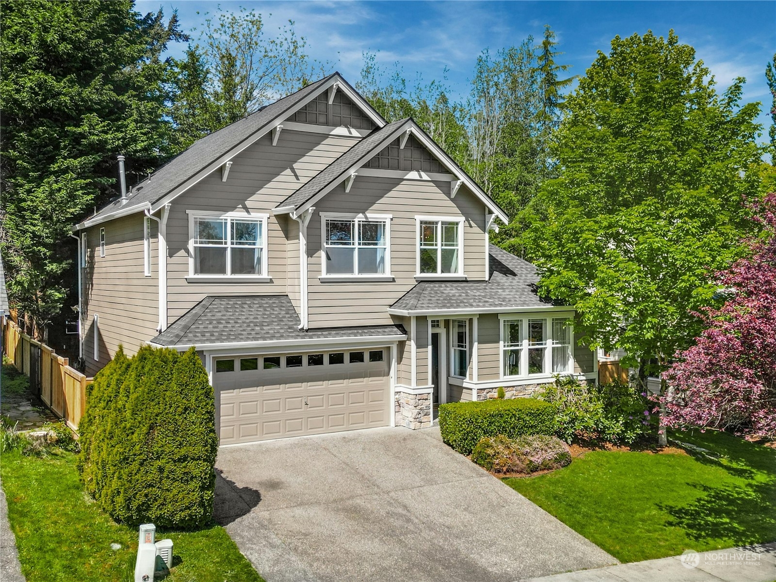 17309 106th Place Northeast Bothell, WA 98011 - Photo 2 of 39 a front view of a house with a yard