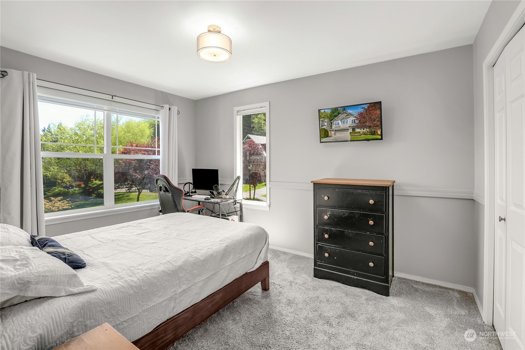 17309 106th Place Northeast Bothell, WA 98011 - Photo 24 of 39 a bedroom with a bed and a large window