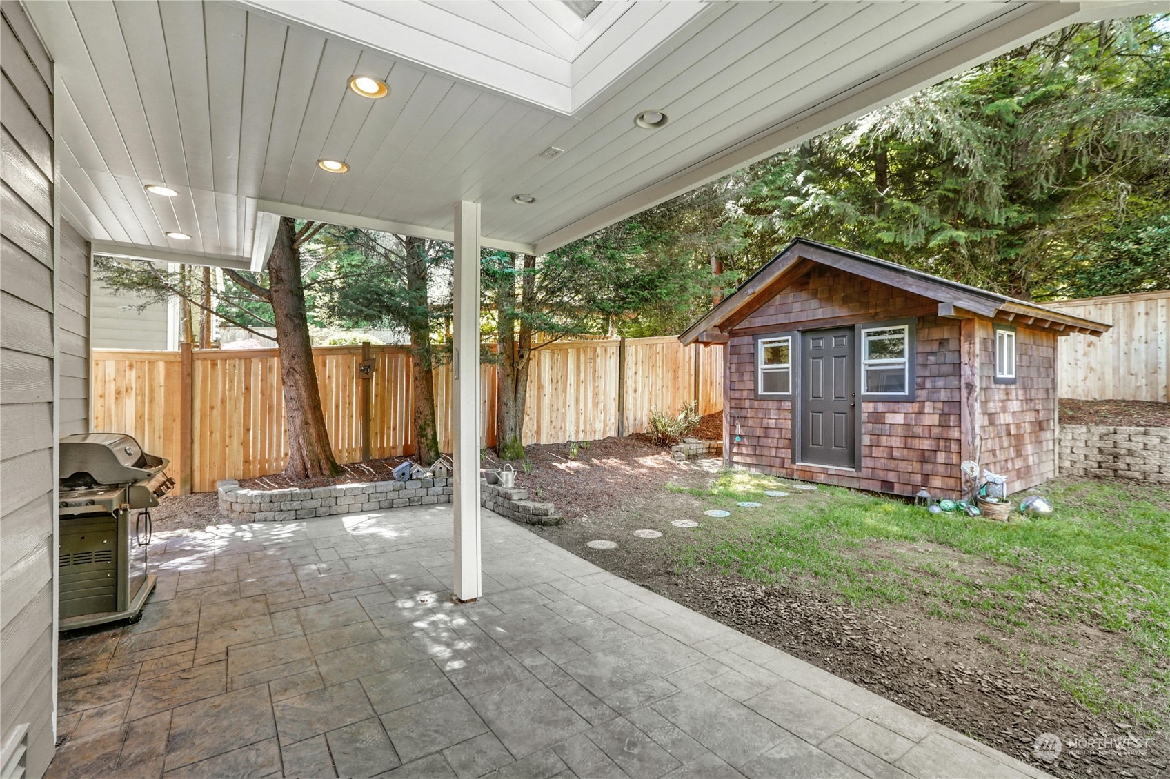 17309 106th Place Northeast Bothell, WA 98011 - Photo 31 of 39 a view of a house with a yard and sitting area