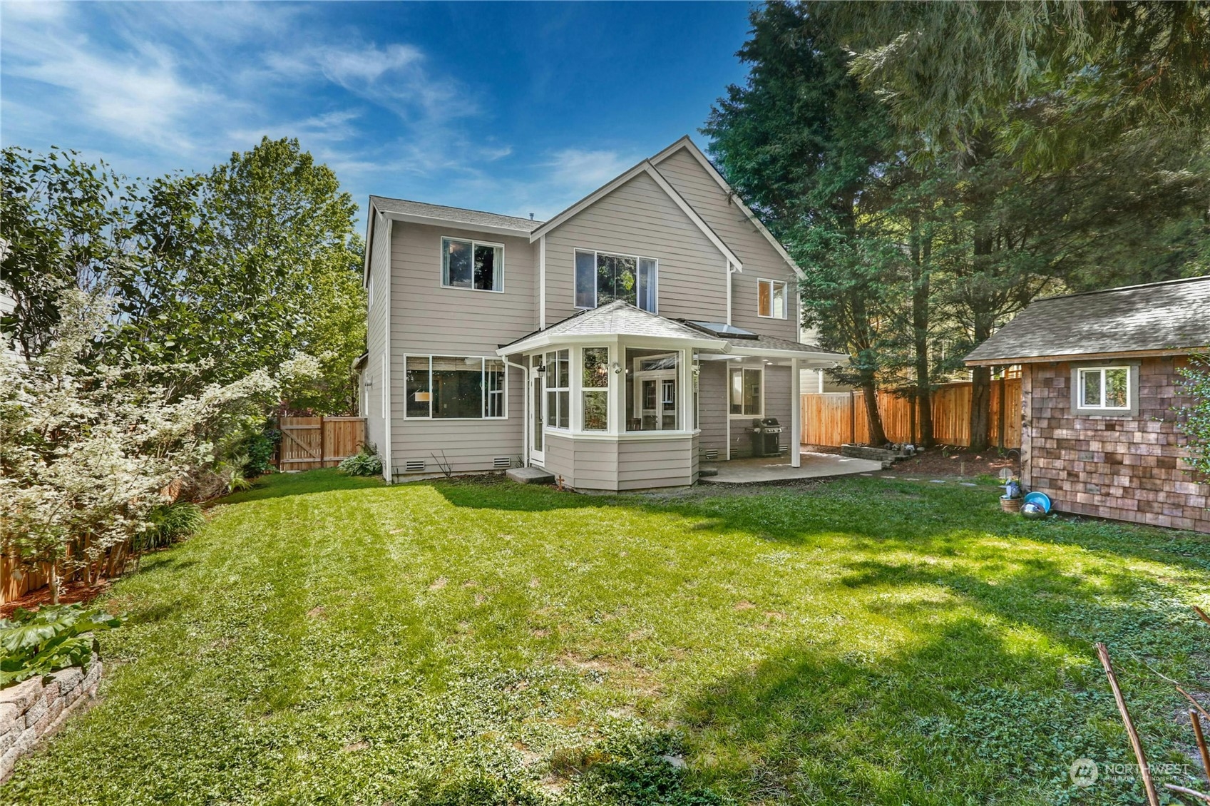 17309 106th Place Northeast Bothell, WA 98011 - Photo 33 of 39 a front view of a house with a garden