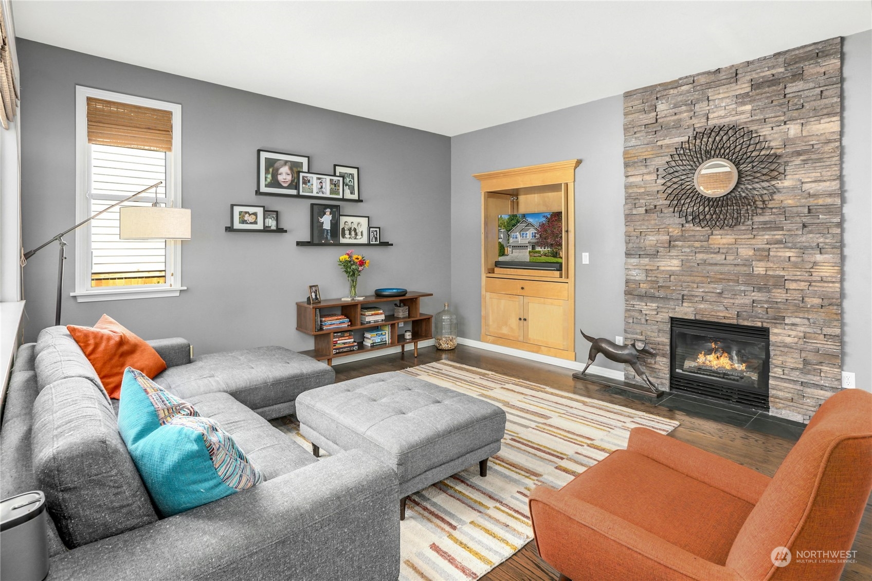 17309 106th Place Northeast Bothell, WA 98011 - Photo 9 of 39 a living room with furniture and a fireplace