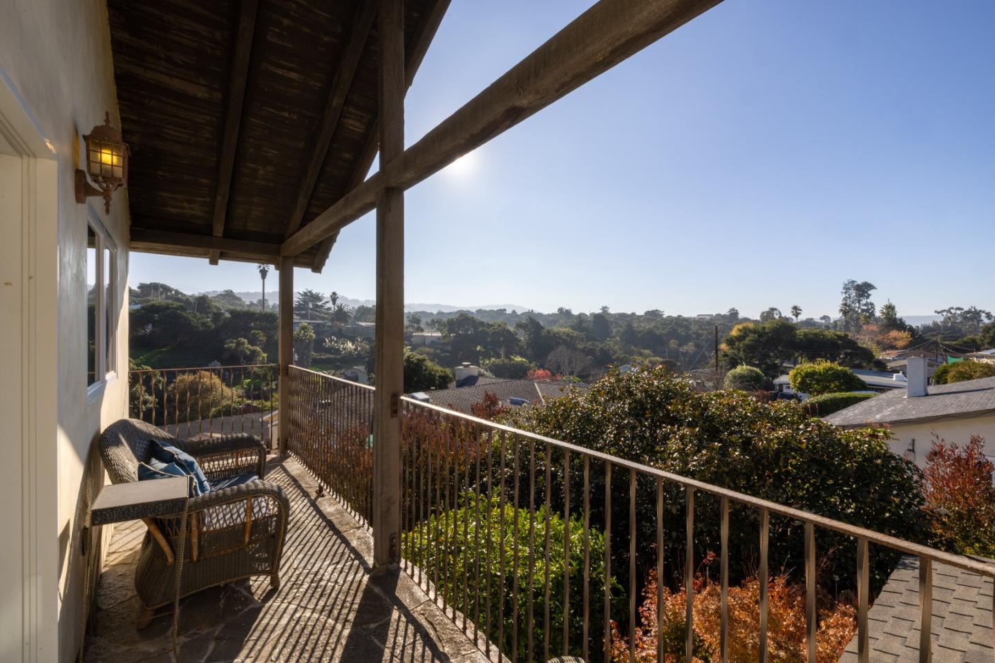 810 Altura Place Del Rey Oaks, CA 93940 - Photo 22 of 57 a view of a balcony with couches wooden floor and a floor to ceiling window