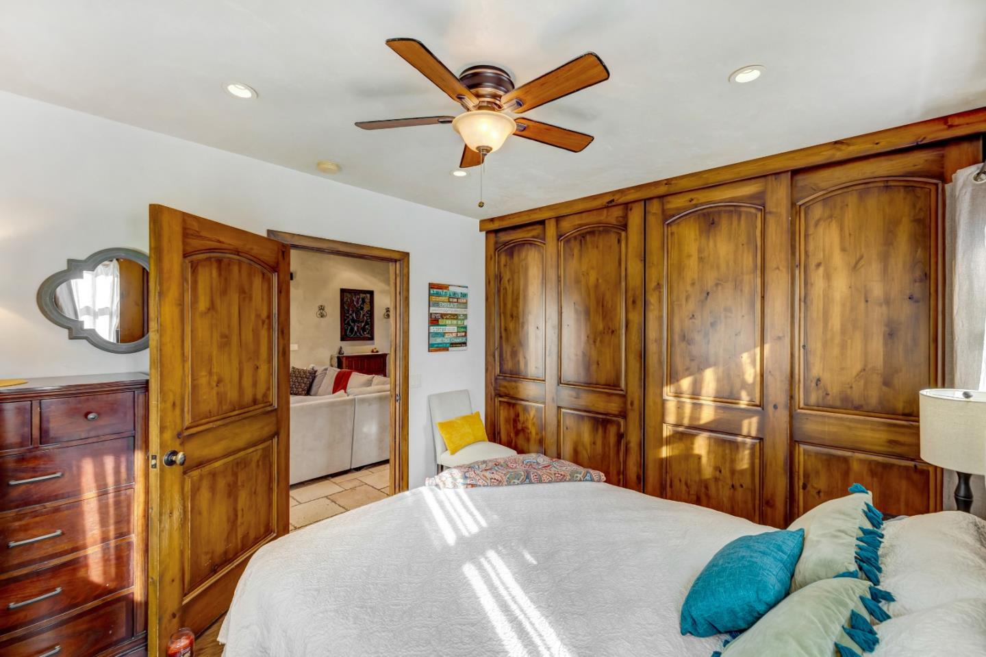 810 Altura Place Del Rey Oaks, CA 93940 - Photo 32 of 57 a bedroom with a bed and dresser with wooden floor