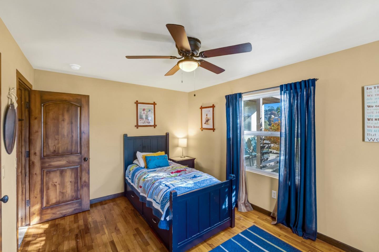 810 Altura Place Del Rey Oaks, CA 93940 - Photo 38 of 57 a bedroom with a bed and wooden floor