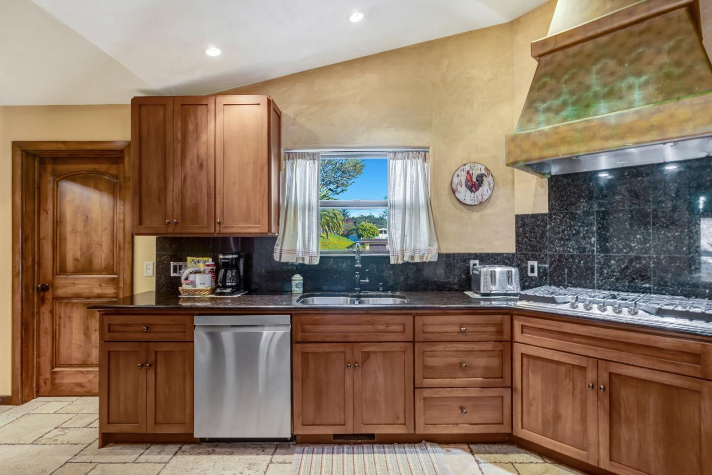 810 Altura Place Del Rey Oaks, CA 93940 - Photo 10 of 57 a kitchen with stainless steel appliances granite countertop a sink and a cabinets