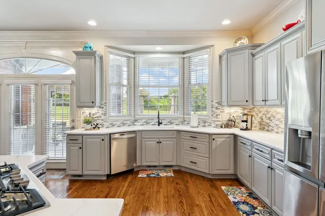 a bathroom with a sink a mirror and vanity