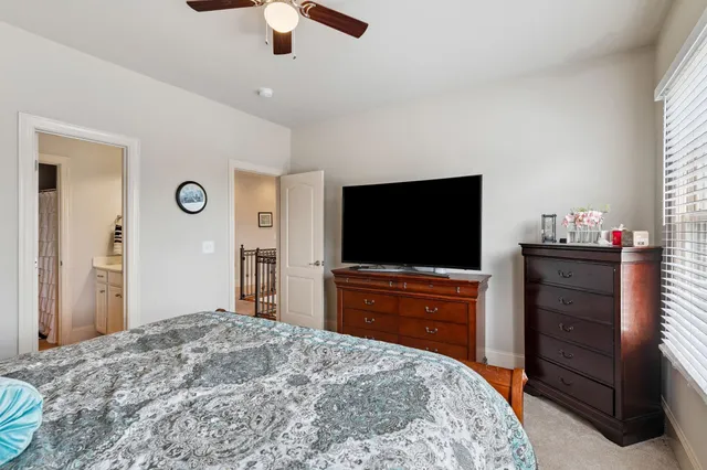 a living room with a couch and a flat screen tv