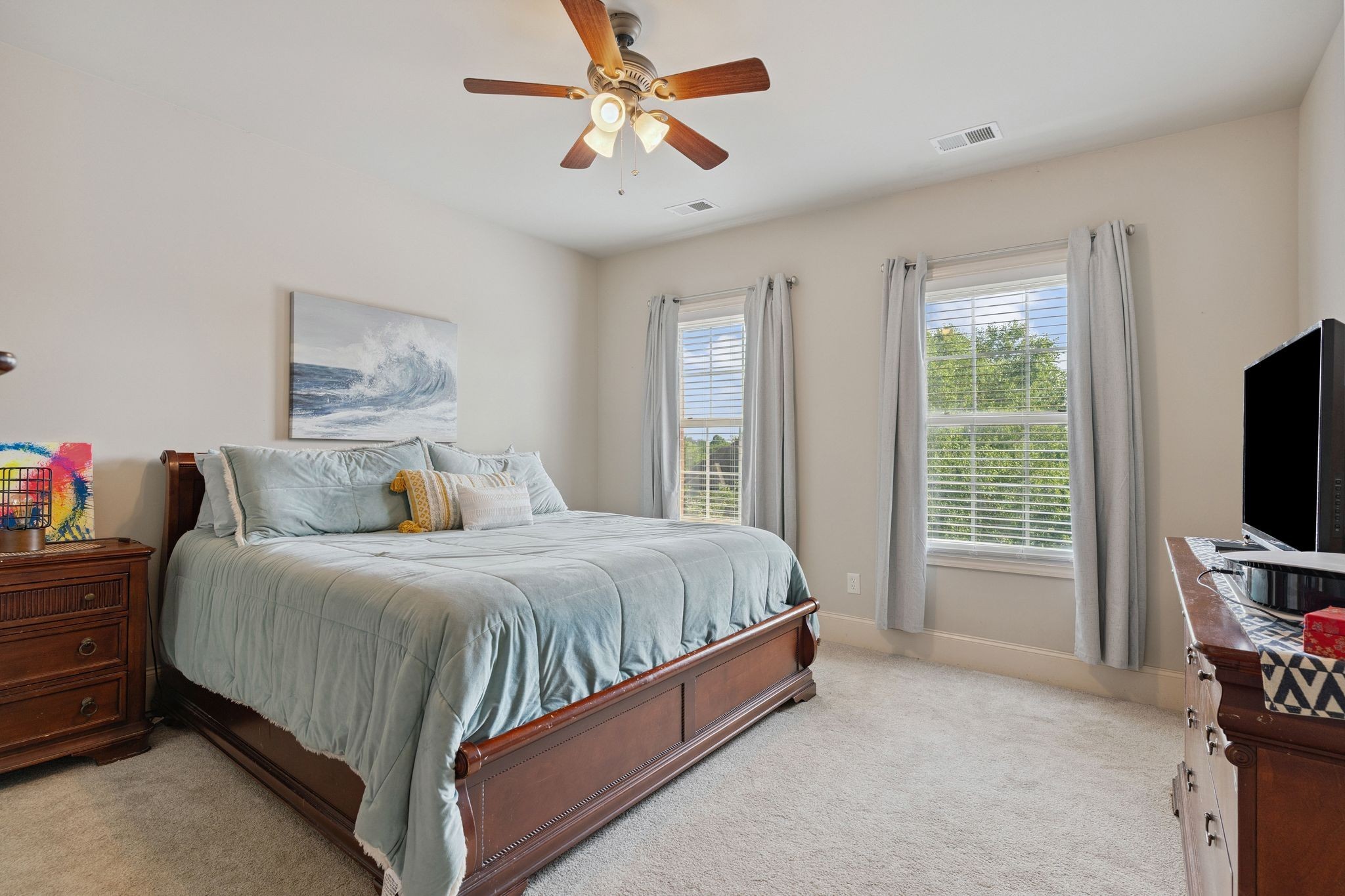 815 Stonebrook Drive Lebanon, TN 37087 - Photo 46 of 71 a spacious bedroom with a bed and a flat tv screen on the dresser