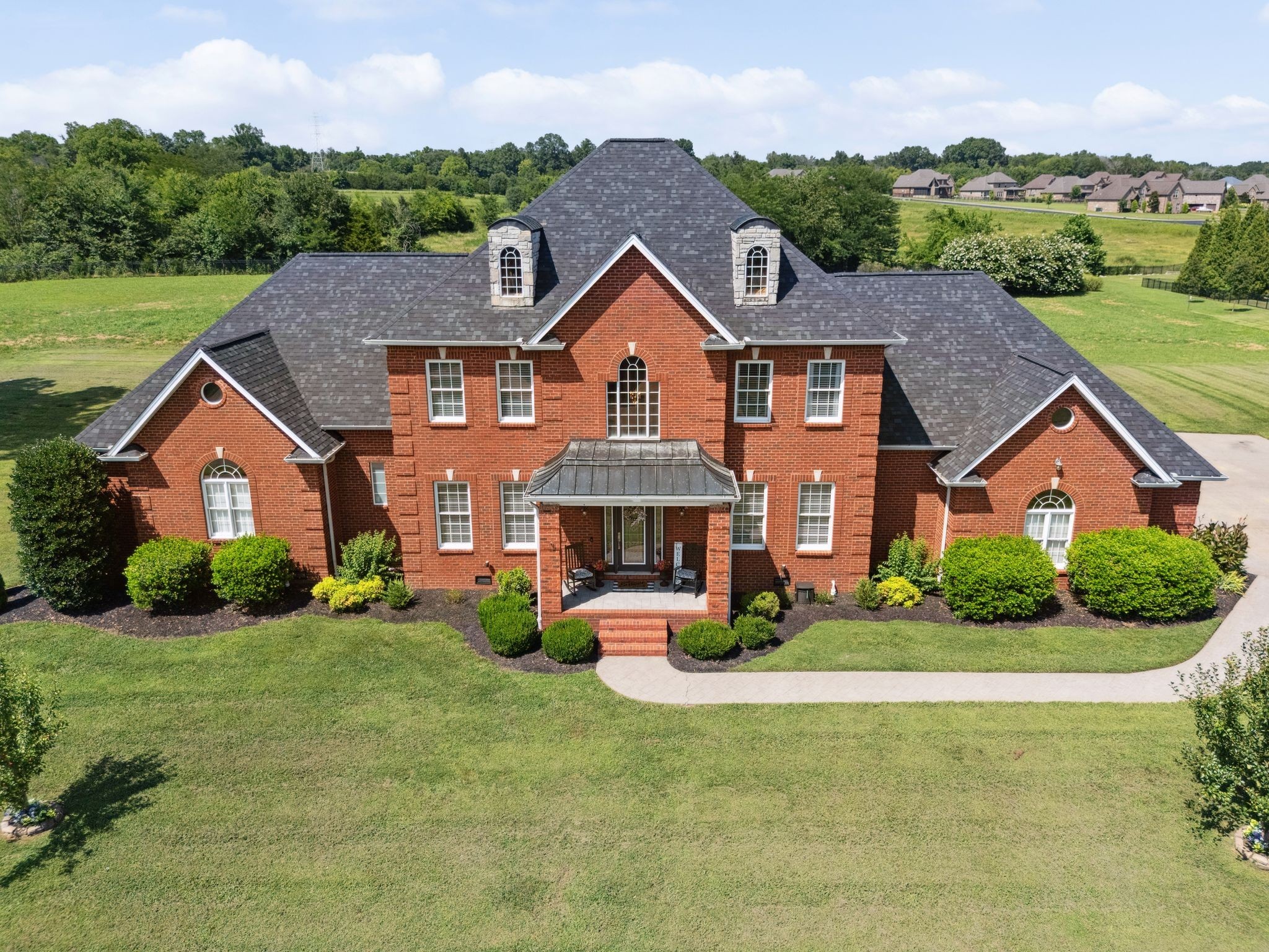 815 Stonebrook Drive Lebanon, TN 37087 - Photo 5 of 71 a front view of a house with a yard and garage