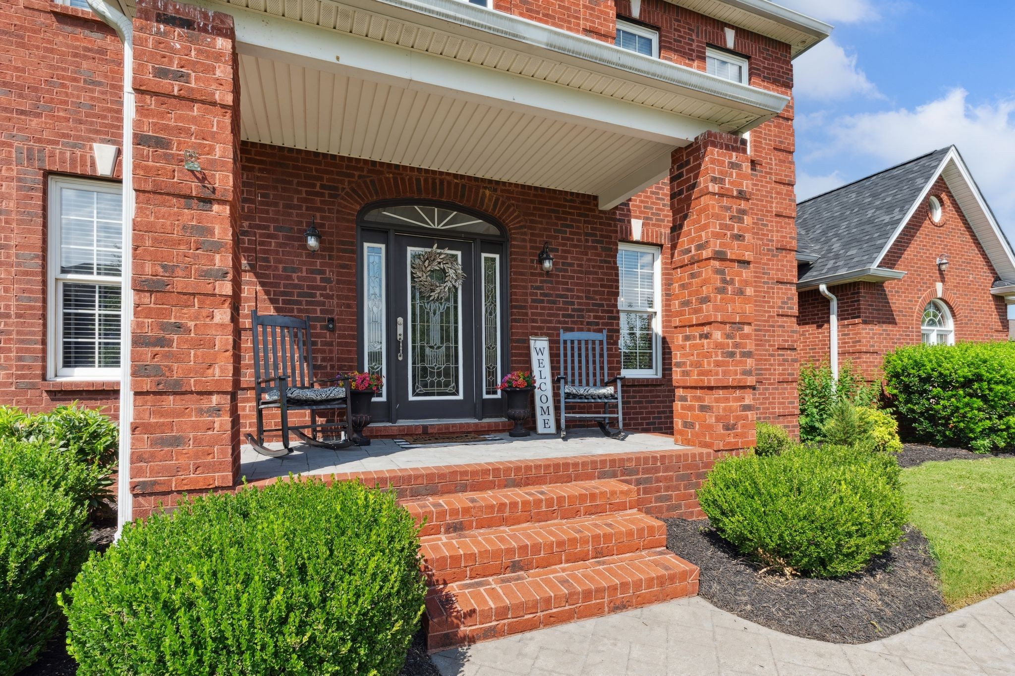 815 Stonebrook Drive Lebanon, TN 37087 - Photo 8 of 71 front view of a brick house with a small yard