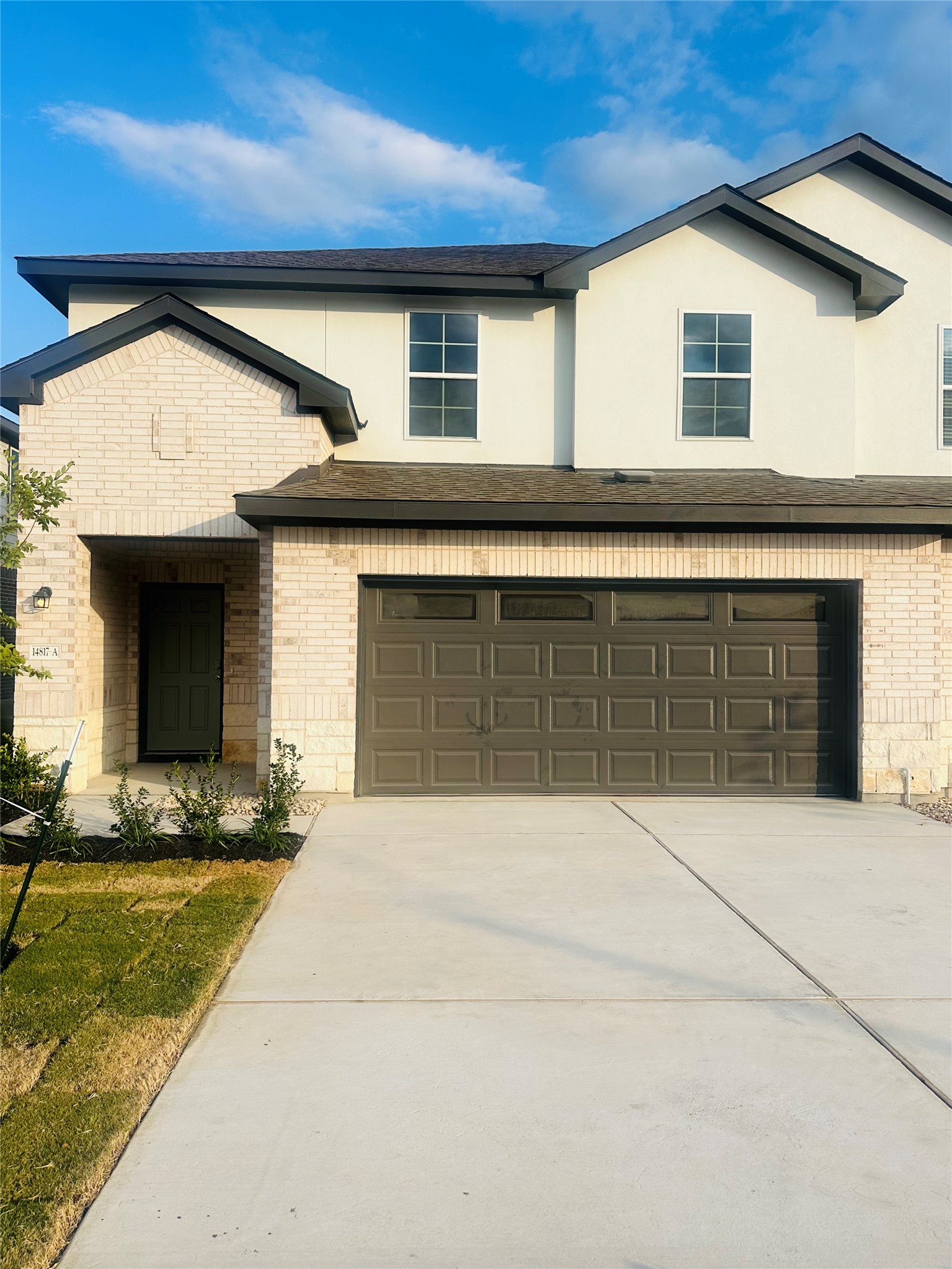 14817 Perlino Way, Unit A Manor, TX 78653 - Photo 40 of 40 a front view of a house with a yard
