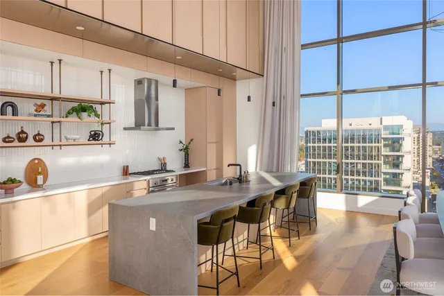a dining room with furniture and a floor to ceiling window